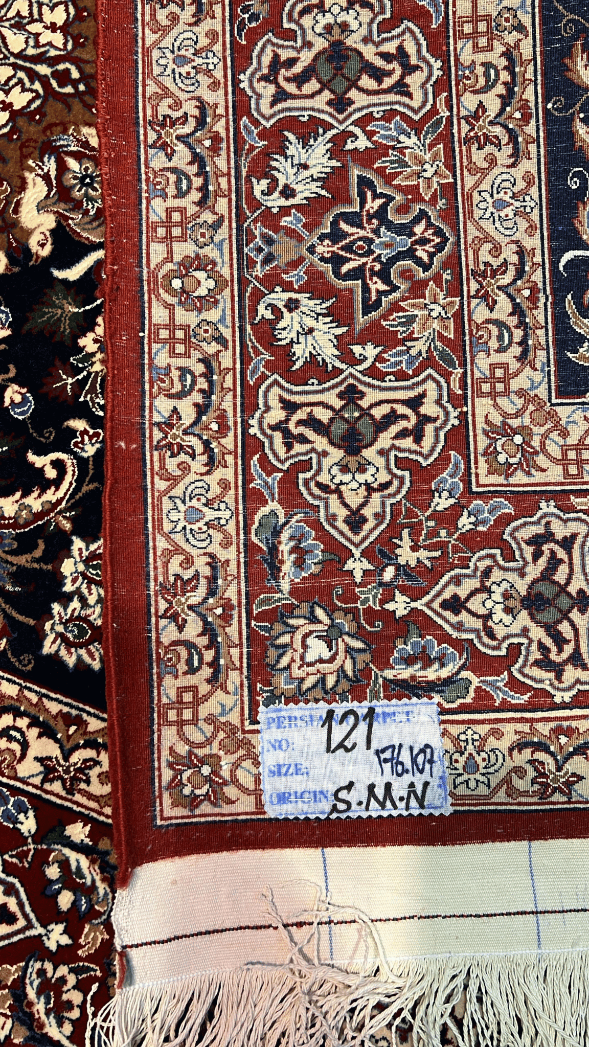 "Backside of a Master Bagher Seirafian rug, showing fine knot craftsmanship with a silk warp and wool pile."